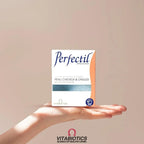 Main d'une femme qui montre une boite de Perfectil